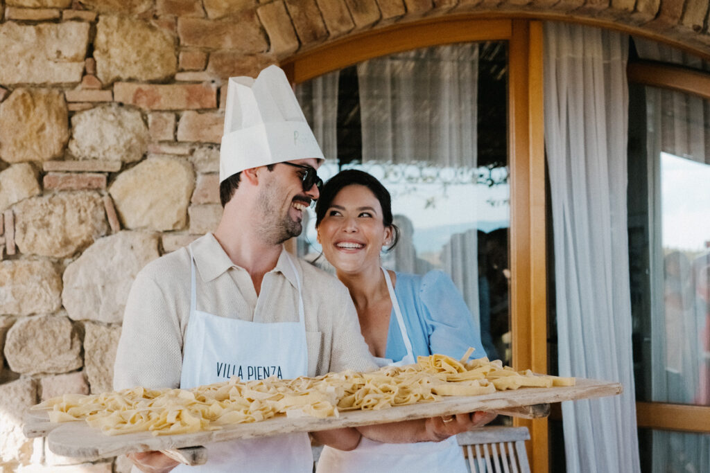 Bride and groom to be at cooking event during Get-Together in Tuscany